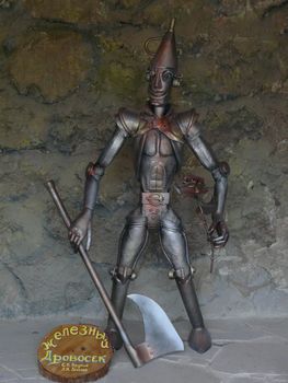 Decorative figurine of the Iron lumberjack with an ax in his hand