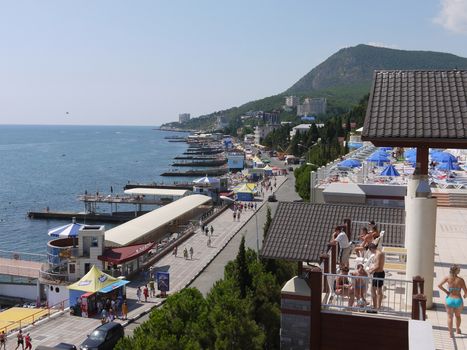 A resort seafront city with hotels, rest areas and restaurants right by the sea