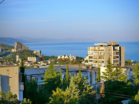 city landscape from high-rise buildings on the background of the sea on a summer sunny day