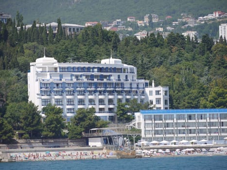 coast of the beach with many vacationing tourists amidst the chic look of the hotel