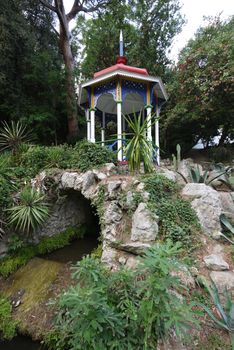 Decorative foliage with colored ornamental details on a stone arch