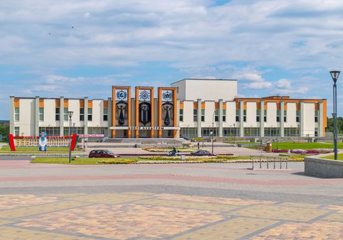 building of the White Culture Center with an orange roof with a lawn in the foreground