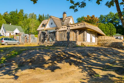 beautiful country house with stone facade on a sunny and clear day