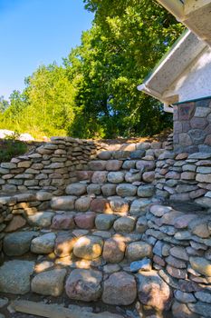 Decorative steps, laid out with small stone cobblestones in the background of the park zone