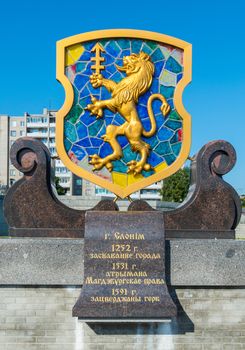 coat of arms with the symbols of the city and a plate of marble with a description of the history and the date of foundation