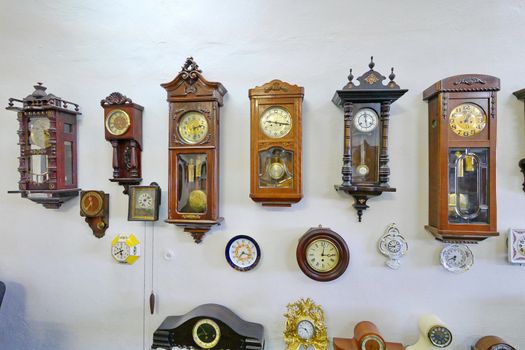 A huge number of completely different clock devices are located on one wall
