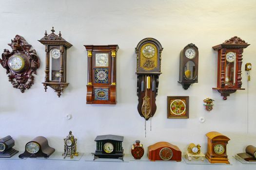 Exposition with a huge number of different ancient wooden clockwork mechanisms