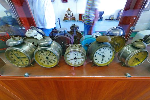 collection of ancient alarm clocks of a round shape