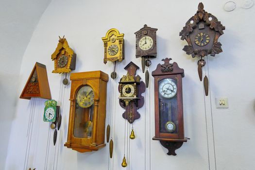 a room with exhibits of ancient clocks of different eras in Palanok castle. Mukachevo.Ukraine
