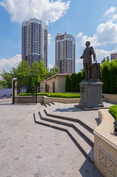 Monument to Heydar Aliyev in the middle of a beautiful square against the background of high modern houses