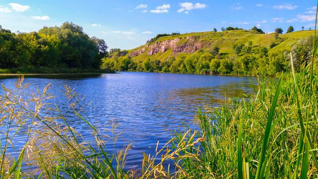 a picturesque landscape of the river making a bend with a high shore