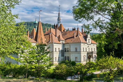 beautiful house of ancient architecture with upstanding spiers of turrets