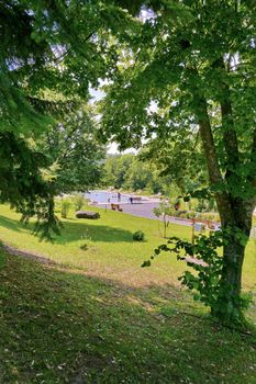 A photo of the pool in the park from a distance, where people came to rest, swim and sunbathe