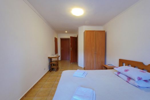 room in the hotel furnished modestly but with taste