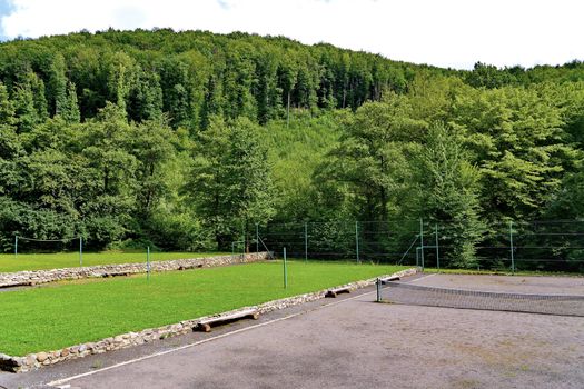 a playground in a dense mountain forest