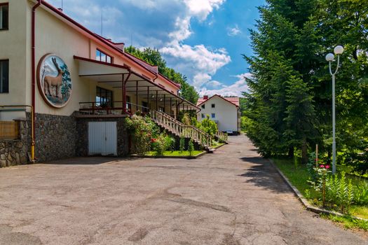 Deer's image on the hotel's fad with terraces and descent to the park