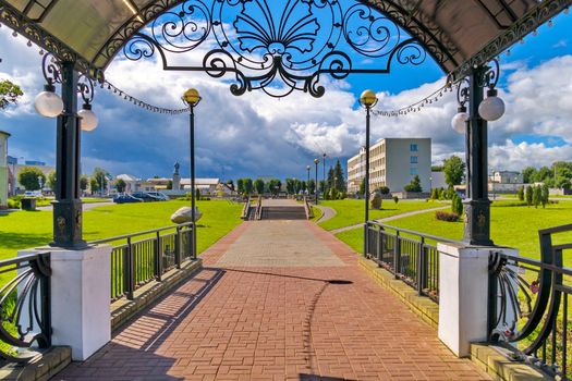 A beautiful canopy with figured railing with an exit directly to the park
