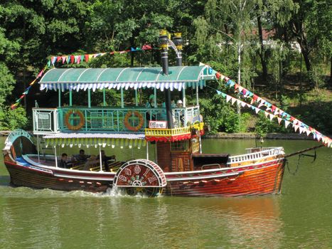 A small two-story boat for tourist walks along the river. Sofa is called