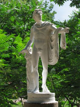 white statue of Apollo Belvedere in the garden