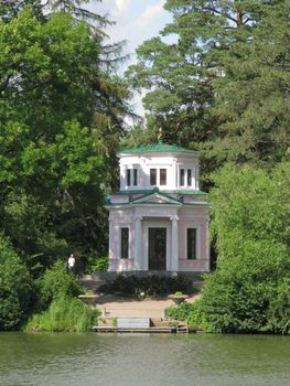 covered with a green roof gazebo in the park near the lake. Uman Ukraine