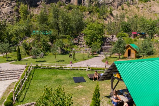 park with a recreation area against the background of trees in the mountains