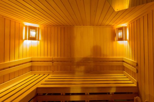 Finnish sauna with two lamps in the corners