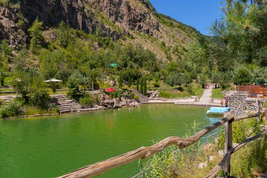 artificial pool for tourists at the foot of the rocky mountains