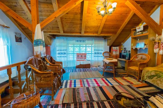 the light room is trimmed with wood and woven sidewalks on the floor