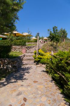 Beautiful stone steps leading to a recreation area with tents and umbrellas