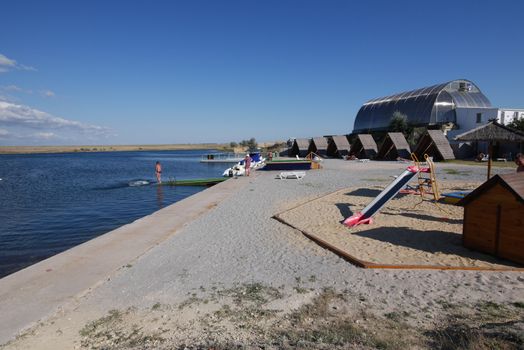 playground on a small beach near the pond