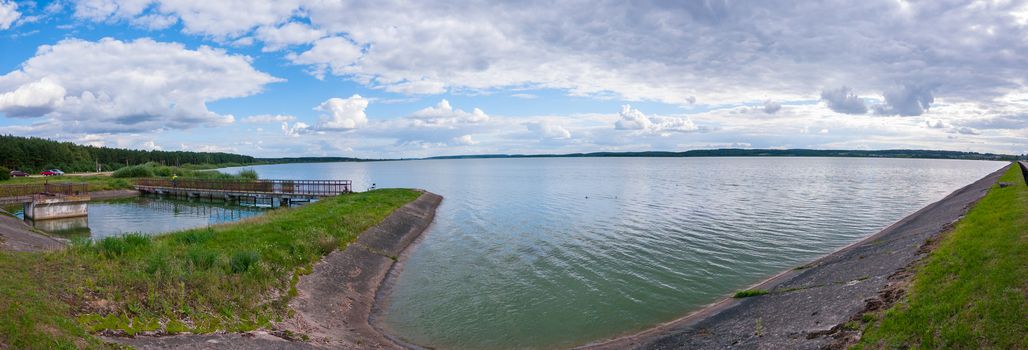 A delightful panorama of the lake with clouds floating unhurriedly over it