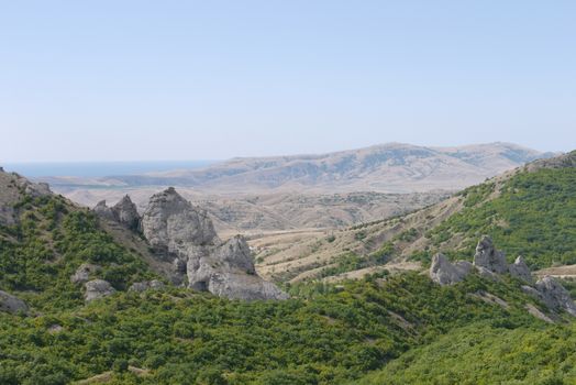 Mountains, rocks and greenery. Excellent location to fly over it on a glider