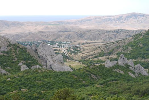 A small resort village is located in the middle of a wide mountain valley