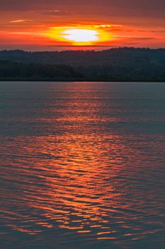 calm sea on the background of a beautiful fire sunset