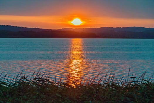 calm sea on the background of a beautiful fire sunset