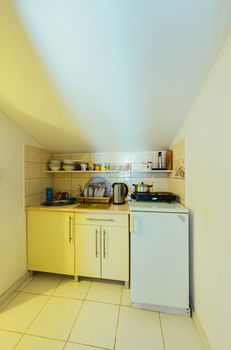 A small cozy kitchen in light colors