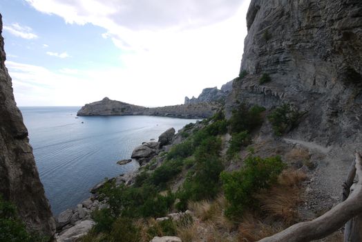 narrow rocky track on the background of a large deep bay