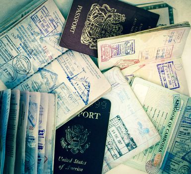 a colection of old used passports 