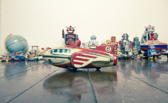 small viintage rocket toy on wooden floor