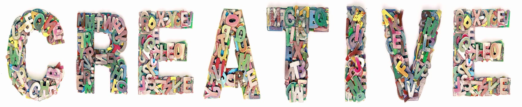 The word Creative made up of lots of  small wooden letters 