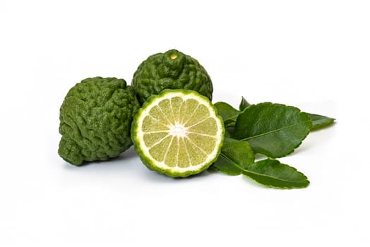 Bergamot fruit kaffir limes and green leaves for herbal products on a white background