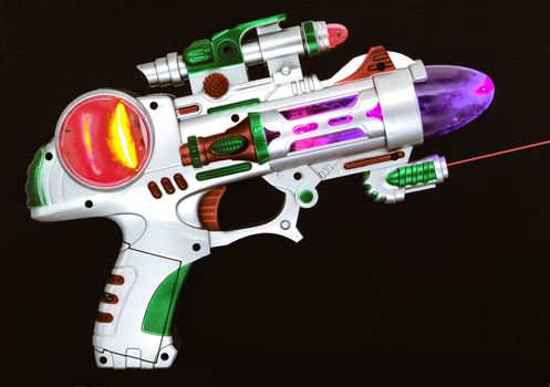 retro  ray gun on a black background