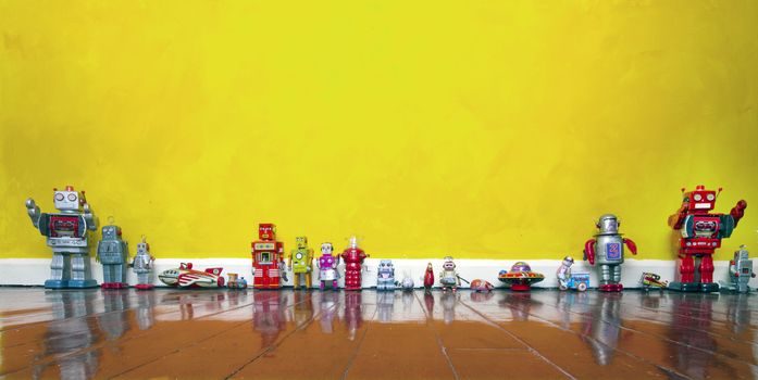 rero tin toys on a wooden floor 