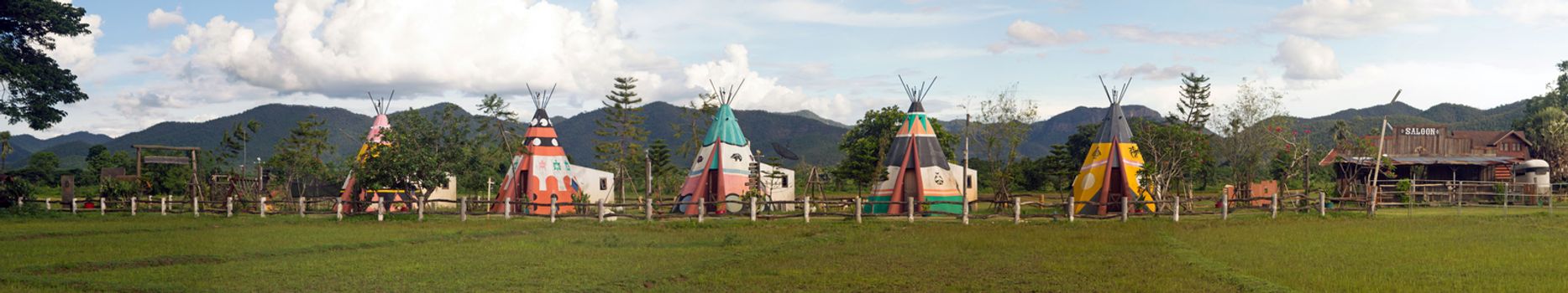 panoramic of wigwams and a old saloon 