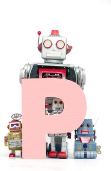 capital letter P held by vintage robot toys 
