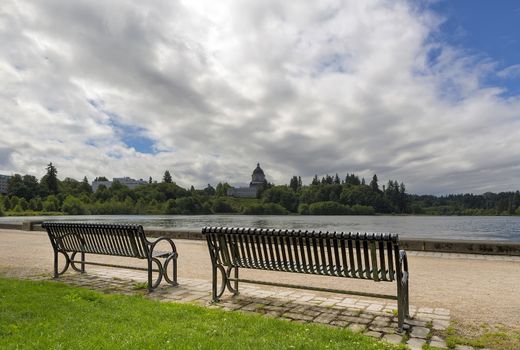 Park bench along scenic Capitol Lake in Olympia Washington State on a cloudy day