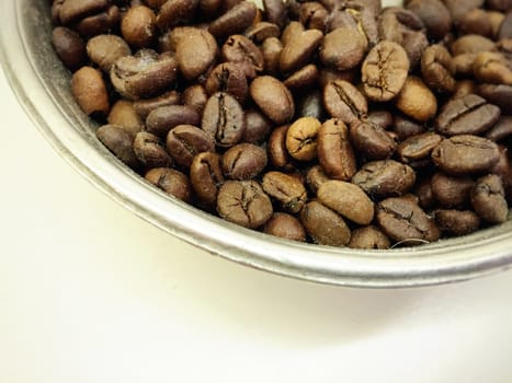 Roasted Coffee beans in a metal bowl