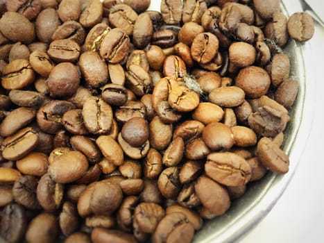 Roasted Coffee beans in a metal bowl