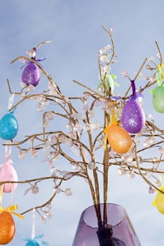 easter egg tree decoration against a clear blue sky