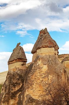 Cylindrical stone cliffs and cave houses near Goreme, Turkey